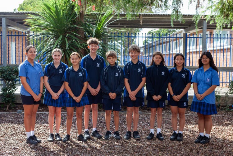 A group of people posing for a photo AI-generated content may be incorrect.